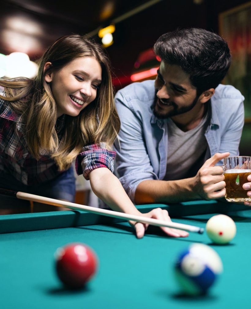 couple-dating-flirting-and-playing-billiard-in-a-pub.jpg